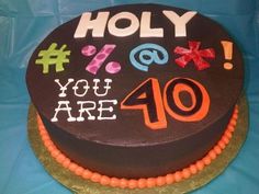 a chocolate cake with the words you are 40 on it, decorated with colorful icing