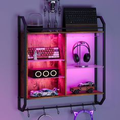 a shelf with various electronic gadgets and toys on it, including a keyboard and mouse