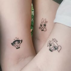 two people with matching tattoos on their arms