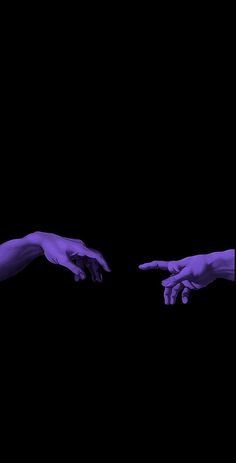 two hands reaching out towards each other with purple paint on their fingertipss in the dark