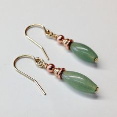 Green Aventurine Copper Earrings Achieve perfectly pretty style with these stone, gold and copper earrings. Handmade from Green Aventurine stones, gold and solid copper metals, these dainty dangles are perfect for everyday wear.  Green aventurine is a light to medium shade of green. Because this soft shade of green pairs well many colors, you will wear these earrings a lot. While these copper earrings are a stylish way to liven up your outfits, copper jewelry is the anniversary gift for 7th and Elegant Aventurine Dangle Earrings, Gold Aventurine Earrings Gift, Green Aventurine Jewelry, Gemstone Lariat Necklace, 22nd Wedding Anniversary, Aventurine Jewelry, Green Aventurine Stone, 7th Anniversary Gifts, Aventurine Stone