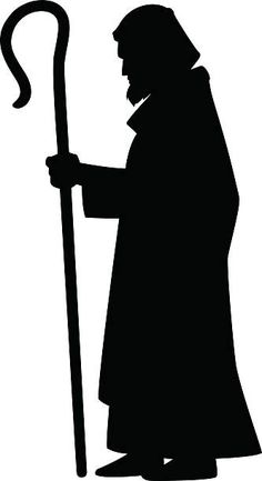 a black and white silhouette of a person holding a staff