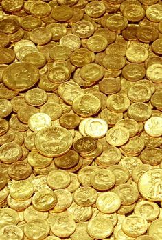 a pile of gold coins sitting on top of each other