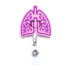 Respiratory therapists, nurses, and allergists love these fun lungs. Designed to hold work badges, this alligator clip, retractable badge reel celebrates the organ that is the topic of everyone’s conversations this year. Approximate size of lung is 2" wide by 1.5" tall. Sons Girlfriend, Medical Badge, Badge Buddy, Work Badge, Nurse Graduation Gift, Nurse Doctor, Tag Holder, Dog Flower, Nurse Badge Reel