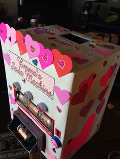 a valentine's day candy machine with hearts on it