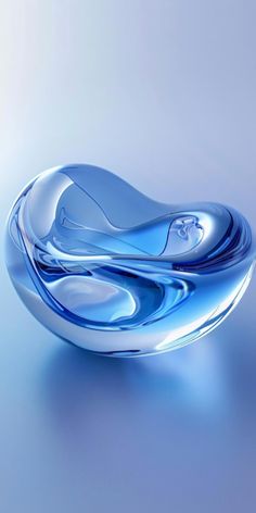 a blue glass bowl sitting on top of a table