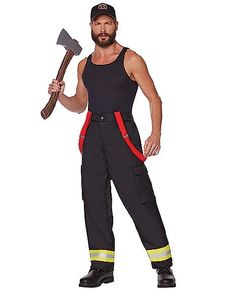 a man dressed as a fireman holding an ax in one hand and wearing overalls on the other