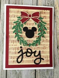 a handmade christmas card with the word joy on it and mickey mouse's head