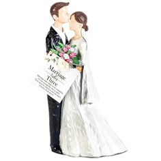 a wedding cake topper with a bride and groom kissing