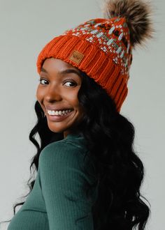 Orange, light blue, mint and olive patterned knit pom hat Natural faux fur pom accent Fleece lined Crown patch on the left side One size 100% Acrylic Beanie With Pom Pom, Beanie With Pom, Knitted Hats Kids, Knit Hat For Men, Colorful Hat, Knit Jewelry, Winter Closet, Blouse Tank Top, Orange Light