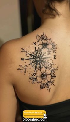 a woman with a compass tattoo on her upper back shoulder and flowers around the neck