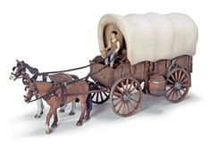 a figurine of a man riding in a horse drawn carriage