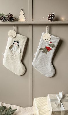 two christmas stockings hanging from the wall