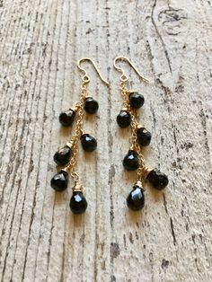 Gold filled dangle earrings wire wrapped with black onyx gemstones 14k Gold Filled Wire Wrapped Drop Jewelry, Black Dangle Earrings With Ear Wire, Nickel Free Black Long Drop Earrings, Black Dangle Linear Earrings, Black Dangle Linear Earrings For Pierced Ears, 14k Gold Filled Wire Wrapped Dangle Earrings, Black Long Drop Earrings With Dangling Beads, 14k Gold-filled Wire Wrapped Dangle Earrings, Nickel-free Black Long Drop Earrings