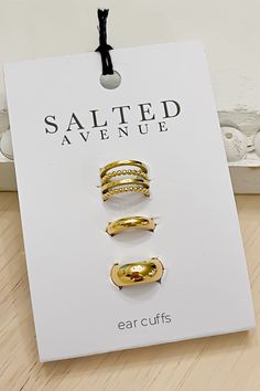 Add some effortless style to your look with our set of 3 stainless steel gold plated ear cuffs! This set includes a quadruple cuff, single thick gold hoop, and single skinny gold hoop cuff, perfect for adding a touch of edge to your ensemble without the need for a piercing. It also makes a great gift for any fashion-forward friend! 3 cuffs Stainless Steel No Piercing needed Adjustable Gold Plated Single Ear Cuff, Adjustable Gold Plated Ear Cuff, Adjustable Gold Brass Ear Cuff, Elegant Gold-plated Hypoallergenic Ear Cuff, Adjustable Gold Nickel-free Ear Cuff, Thick Gold Hoops, Gold Hoop, Nail Wraps, Effortless Style