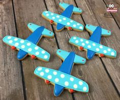 decorated cookies in the shape of an airplane