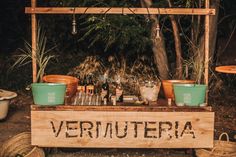 an outdoor bar with bottles and glasses on it