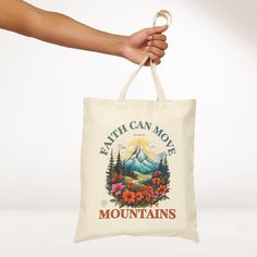 Faith Can Move Mountains Canvas Tote Bag Elevate your everyday with our Christian Canvas Tote Bag, a stylish and durable accessory designed to carry more than just your belongings—it carries the powerful message of faith. This 100% cotton bag comes in one size – 15" x 16"– perfect for everyday wear. The bag features 20" handles (made from the same canvas), making it easy to carry even with a week's worth of shopping. Design is printed on one side! .: 100% cotton canvas.: Heavy fabric.: Sewn-in l Inspirational Letter Print Bags For Everyday Use, Inspirational Tote Bags For Everyday Use, Christian Canvas, Faith Can Move Mountains, Mountain Canvas, Shopping Design, Canvas Making, Move Mountains, Jesus Saves