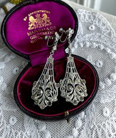 Featuring an absolutely gorgeous pair of antique Art Deco 1920s rhodium plated screw back drop Chandelier earrings adorned with dazzling closed back faceted Diamond paste stones.  Earrings measure approximately 2.5  inches long at 10.52  grams respectively with both pieces in fine antique condition with functional clasps, a nice patina with all stones intact and accounted for.  These beauties are just so sophisticated, beautifully made and ready to wear!!  Please feel free to contact me with any Art Deco Diamond Earrings For Formal Occasions, Victorian Screw Back Wedding Earrings, Vintage Pierced Diamond Earrings For Formal Events, Victorian Screw Back Earrings For Wedding, Vintage Pierced Diamond Earrings For Formal Occasions, Victorian Wedding Earrings With Screw Back, Victorian Silver Chandelier Earrings, Vintage Earrings With Intricate Design For Evening, Vintage Hallmarked Diamond Drop Earrings