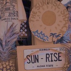 some signs and pineapples are on display