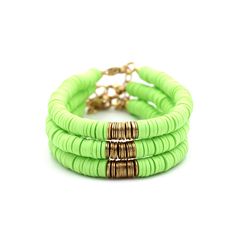 A lime green heishi bead bracelet is the perfect on-trend accessory to top off your look. It is a great stand alone bracelet and works well as a stack bracelet, too. This non-stretch bracelet features lime green polymer clay heishi beads with gold brushed metal beads in the center, all hand-strung onto flexible jewelry wire. The bracelet is finished off with a lobster clasp, and a 1" extender chain to accommodate various wrist sizes. MATERIALS Polymer Clay & Metal Beads SIZE 6 1/2" Extendable Up Trendy Green Stretch Bracelet Stackable, Trendy Green Stackable Stretch Bracelet, Green Heishi Beads Jewelry For Beach, Green Heishi Bead Jewelry Bracelet, Green Stackable Stretch Bracelet For Beach, Green Bohemian Heishi Beads Stretch Bracelet, Trendy Green Heishi Beads Bracelets, Green Stackable Jewelry For The Beach, Trendy Green Bracelets For Spring