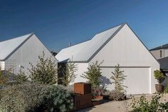 two large white buildings sitting next to each other