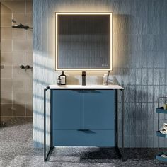 a bathroom vanity with blue cabinet and mirror