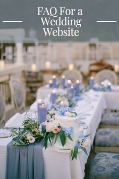 a wedding cake sitting on top of a table covered in blue and white cloths