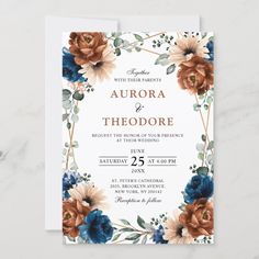 an elegant floral wedding card with blue and orange flowers