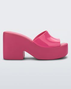 Side view of a Melissa Posh platform slide in pink Trendy Summer Slip-on Clogs, Trendy Platform Sandals With Closed Toe, Trendy Closed Toe Platform Sandals, Trendy Closed Toe Platform Slippers, Casual Summer Platform Mules, Trendy Summer Platform Slippers, Summer Synthetic Mules With Rubber Sole, Casual Sandals With Chunky Platform And Open Heel, Casual Spring Platform Slippers With Open Heel