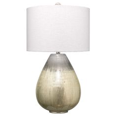 a table lamp with a white shade on it