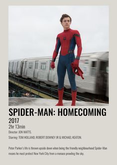 a man in spider - man costume standing next to a train with the words spider - man home coming on it