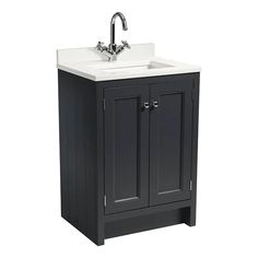 a bathroom vanity with a white sink and black cabinet