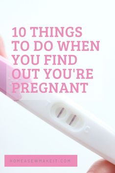 a person holding a pink pen with the words 10 things to do when you find out your pregnant