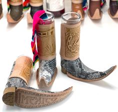 "Mexican Leather Mini Boot Tequila Shot - Original Artisan of Mexico, Bota Tribalera para Tequila, glass shot included and sarape also included, all handmade in Mexico. Leather hand carved in Mexico, The upper part of the boot the leather design is handcrafted will vary but for the most part everything will be the same. The small sarape will be different color will not be as in picture, the overall height of boot with glass shot is about 6\" inches, the glass shoot is about 4.25\" inches glass t Mexican Bar, Tequila Shots, Leather Design, Leather Mini, Tequila, Cowboy Boots, 6 Inches, Primary Colors, Different Colors