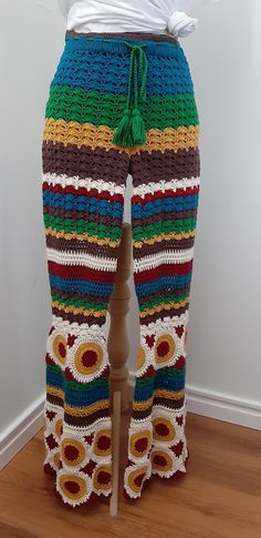 the pants are crocheted and have multicolored stripes