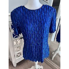 "Laurence Kazar vintage 80s/90s silk beaded sequin top. Absolutely stunning piece with scallop hem and all over beaded detail. Lined with shoulder pads.  Size large / bust 18\" / length 26\" / slight wear under the arms from rubbing but overall amazing preowned condition" Glamorous Fitted Beaded Tops, Fitted Sequin Short Sleeve Blouse, Fitted Short Sleeve Blouse With Sequins, Beaded Short Sleeve Top For Party, Vintage Beaded Fitted Tops, Vintage Fitted Beaded Tops, Fitted Vintage Beaded Tops, Fitted Beaded Short Sleeve Tops, Glamorous Blue Sequined Tops