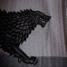 a black and white photo of a game of thrones house starker logo on a towel