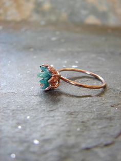 Rough Emerald ring in my best selling lotus flower design. A handcrafted rose gold fill band and cup filled with small raw Emerald chips, my signature design. Designed to represent a delicate lotus flower. Organic, natural Emerald greens in varying shades look pretty and unique next to the Rose Gold Emerald Ring, Lotus Flower Jewelry, Smaragd Ring, Lotus Flower Design, May Birthstone Rings, Bohol, Gemstone Engagement, May Birthstone, Ring Rose Gold