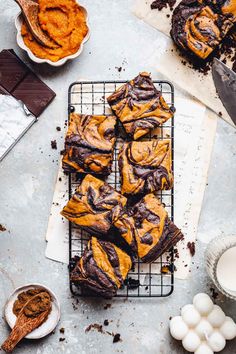 chocolate and peanut butter swirl brownies on a cooling rack next to other desserts