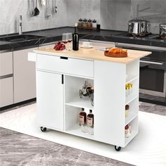 a white kitchen island with two shelves and spices on the bottom shelf in front of it