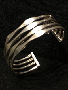 "Old Mexican Sterling Silver abstract modern cuff bracelet with attractive MCM style sculptural positive space-negative space design. Mexico & 925 stamps, plus another one I can't make out, possibly the hallmark of the maker? .75\" wide 5 1/8\" interior circumference plus 1 3/8\" flexible gap 25g 507R - This stunning piece is coming from an exciting relationship with a well known & popular Santa Fe, NM, jewelry gallery. I will be listing many exquisite pieces, some at lower prices than t Modernist Cuff Bracelet With Polished Finish, Modernist Polished Cuff Bracelet, Modernist Polished Cuff Bangle Bracelet, Contemporary Polished Bangle Cuff Bracelet, Modern Sterling Silver Cuff Bracelet Bangle, Contemporary Sterling Silver Bangle Bracelet, Modernist Sterling Silver Bangle, Modern Cuff Bangle Bracelet, Modern Jewelry With Unique Design And Open Band