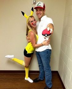 a man and woman dressed up as pokemon characters posing for a photo in front of a wall