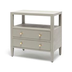 a white night stand with two drawers and gold knobs on the bottom, against a white background