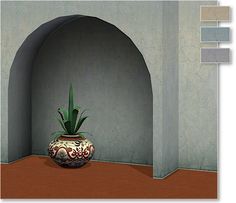 a potted plant sitting on top of a wooden floor next to an arch in a wall