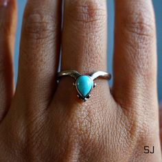 "This fine sterling silver ring features natural turquoise. Adjustable ring band allows you to wear it on any finger or stack with others. 100% Solid 925 sterling silver Authentic turquoise from Arizona, US Handcrafted Size: adjustable band, fits all sizes * By Sowell Jewelry. Stamped with \"925\" and \"SJ\" Official site: www.sowelljewelry.com SUBSTANTIAL PACKAGING: To ensure our packaging is as eco-friendly as possible, we only use recyclable materials such as paper and cardboard." Turquoise Gemstone Stackable Promise Rings, Silver Stackable Turquoise Ring With Open Shape, Silver Stackable Open Turquoise Ring, Silver Stackable Turquoise Ring For Anniversary, Unique Stackable Turquoise Ring For Anniversary, Spiritual Sterling Silver Turquoise Promise Ring, Stackable Silver Open Turquoise Ring, Stackable Open Silver Turquoise Ring, Open Turquoise Ring For Promise