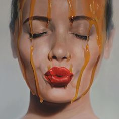 a woman's face is covered in chocolate dripping from the top and bottom half