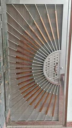 a metal door with wooden handles and bars on it