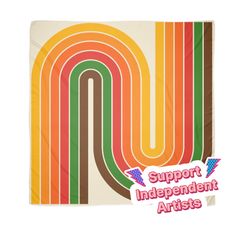 an orange, green, yellow and red striped blanket with the words support independent artists on it