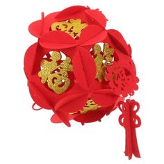 a red paper ball with chinese characters on it and a ribbon tied around the top